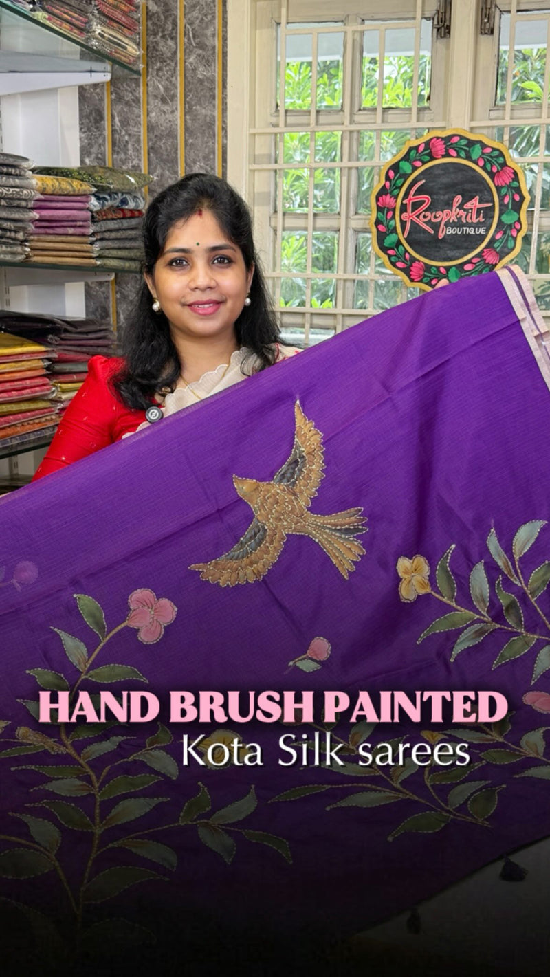 This exquisite hand-painted Kota silk saree is a true work of art, blending tradition with elegance.